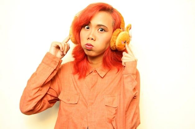 A person holding retro headphones, intently listening, with a focused expression on their face.