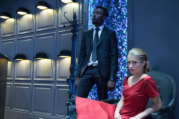 A picture of a reality TV show contestant being consoled by another contestant, showcasing the emotional intensity and social dynamics often present in these shows. The backdrop should be a typical reality TV set.