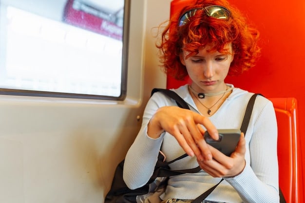 A person on a subway train, engrossed in their smartphone. The phone screen shows a dynamic, short-form streaming video, clearly optimized for mobile viewing, possibly featuring vibrant colors and quick cuts, designed for 