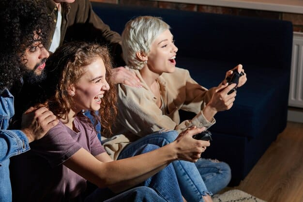 A group of friends gathered, laughing and discussing a series, with a tablet showing a streaming platform open nearby. The scene suggests a communal appreciation for binge-watching.
