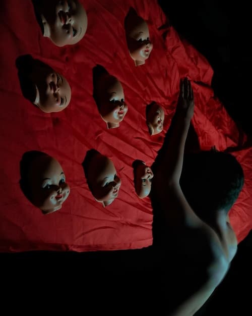 A tense shot from a K-drama thriller, featuring a group of characters huddled together in a dimly lit room, their faces etched with fear and suspicion, with subtle forensic evidence markers in the background.