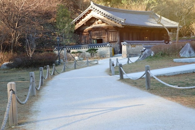 A high-quality screenshot from a virtual tour application, showing a panoramic view of a traditional Korean village (hanok) with clear details, possibly tagged with a K-drama title.
