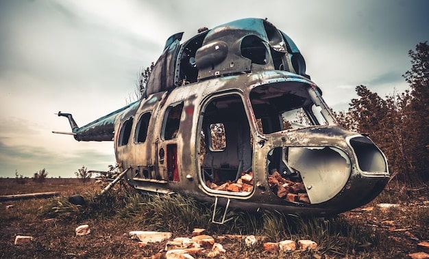 Jadis in a CRM helicopter, looking out with a serious expression, the vast, post-apocalyptic landscape visible below.
