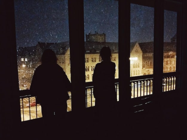 A group of people h huddled together in a dimly lit, rustic house, looking out a window into impenetrable darkness, their faces reflecting fear and uncertainty, with intricate talismans visible on the window frame.