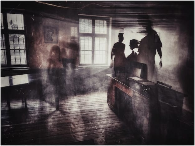 A still from a tense scene in a crime drama series. Detectives are poring over evidence in a dimly lit room, their faces illuminated by the glow of computer screens. The atmosphere is thick with suspense, and the composition of the shot emphasizes the high stakes and intricate details of the case. The scene encapsulates the key elements that make the series binge-worthy.