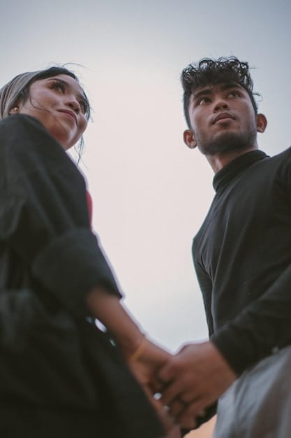 A close-up shot of two K-drama leads holding hands during a pivotal scene in a bustling Seoul street, signifying their growth 'from' initial awkwardness to a deep romantic connection. The focus is on their intertwined hands, capturing the emotion and the city lights blurred in the background for depth.