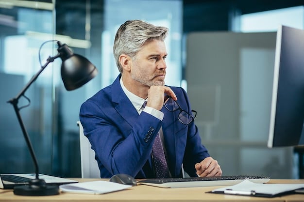 A concerned-looking executive in a modern office setting, possibly reflecting on the decision of whether or not to greenlight a ''Succession' Spinoff? HBO Executives Hint at Potential Expansion of the Universe – What Characters Could Return?'.