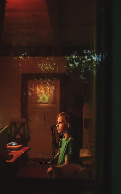 A dimly lit office scene from 'Severance' Season 2, featuring Patricia Arquette as Harmony Cobel looking intensely at a computer screen. The image highlights the show's use of shadows and stark lighting to create a sense of unease and mystery.