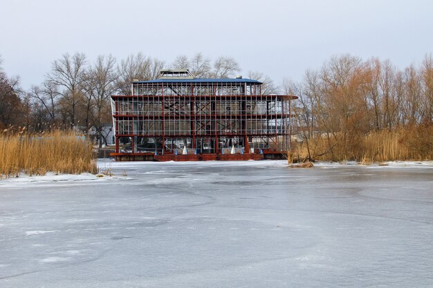 A wide shot of the Foundation's headquarters on Terminus in Foundation Season 3. The settlement is bustling with activity, but there are also signs of unrest and conflict, symbolizing the tensions between predetermined plans and individual aspirations.