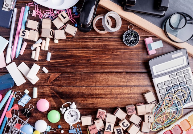 An image showing several items laid out on a table, each representing different clues from past seasons of 